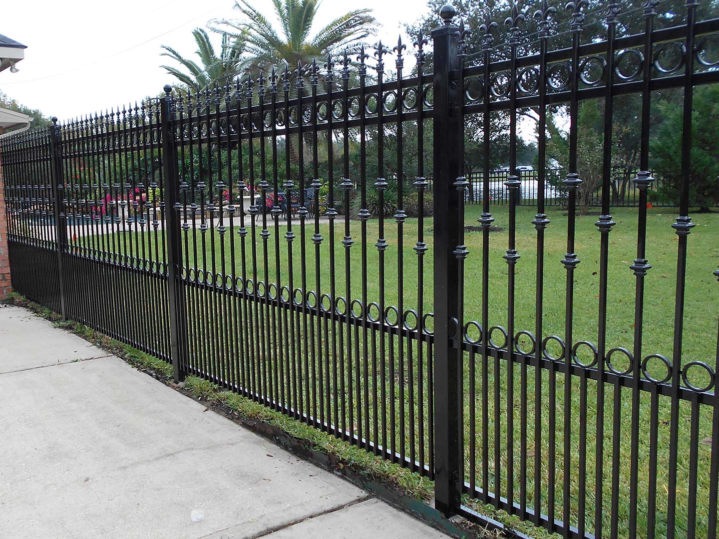 Photo of a decorative ornamental iron fence from a Southwest Houston fence contractor